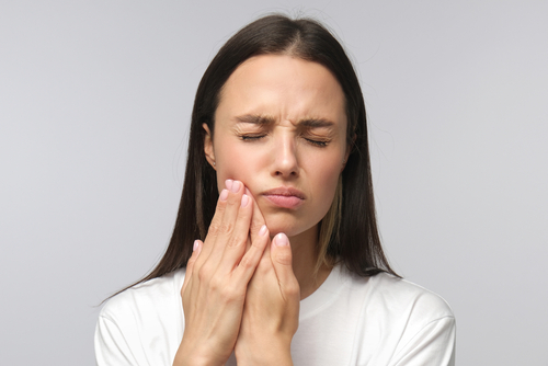 woman with tooth pain